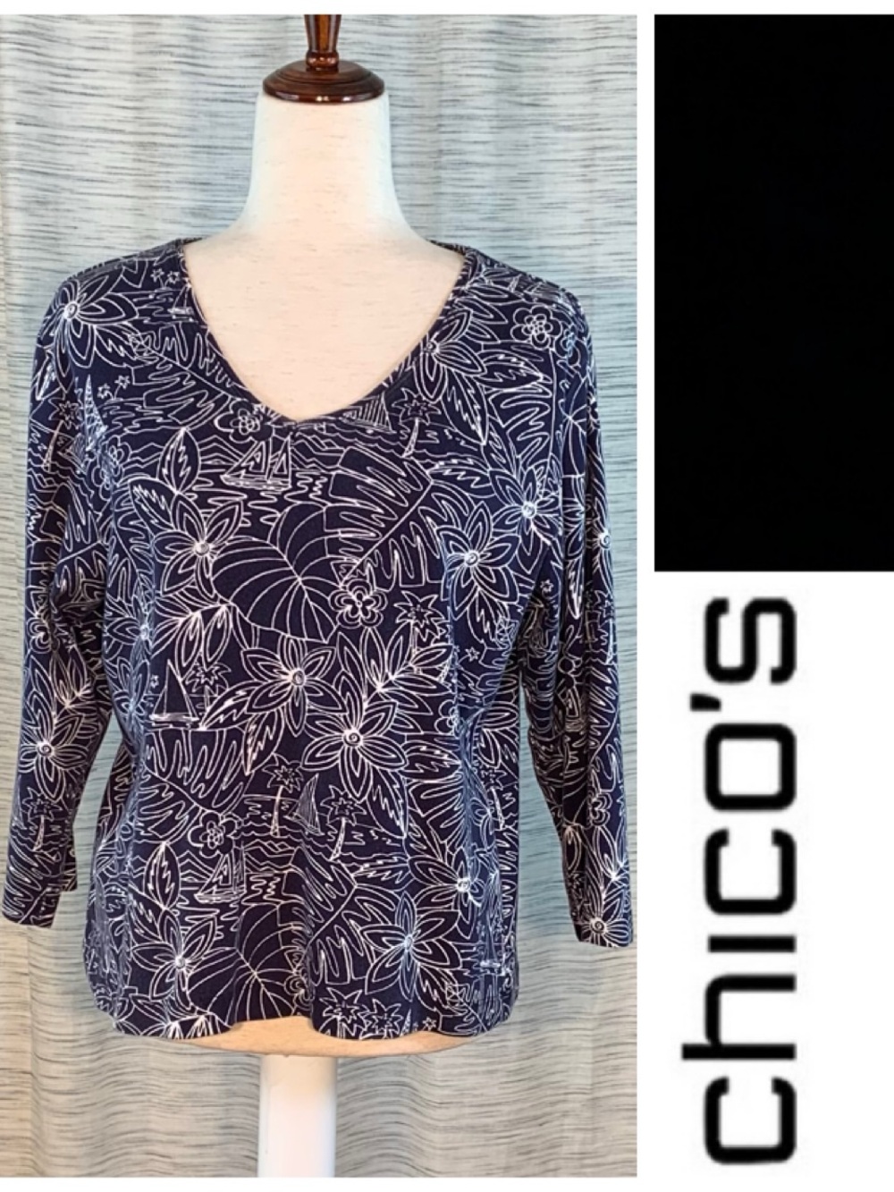 Chico’s navy blue and White Island floral and sails 3/4 sleeve pullover blouse.